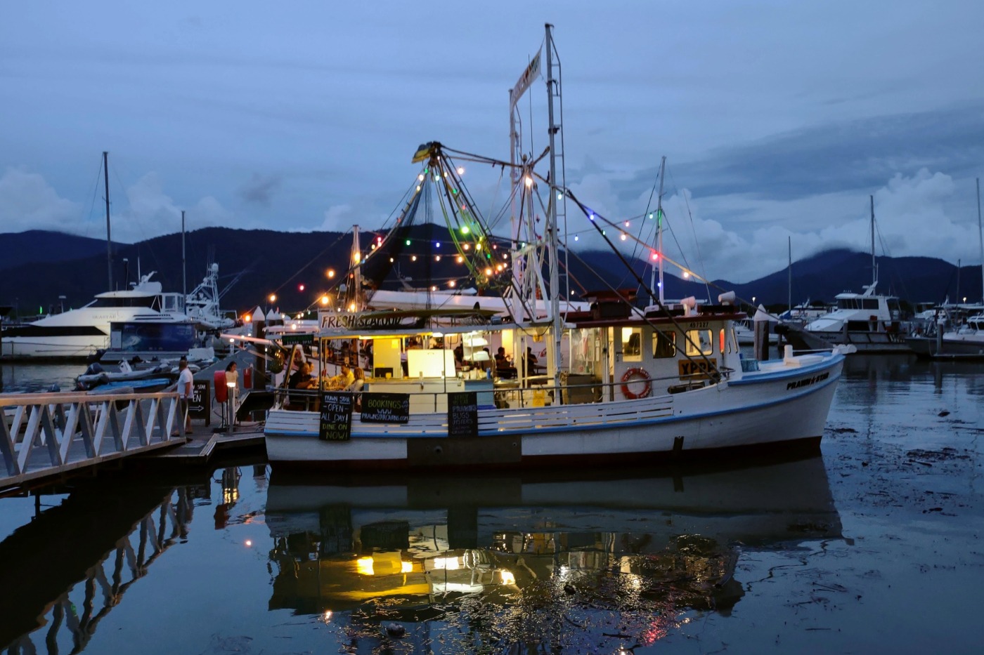 Trawlers converted to restaurants in Cairns. Prawn Star