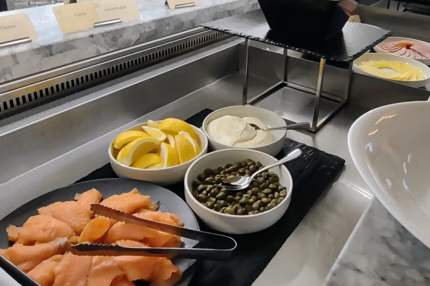 smoked salmon, capers, lemon, sour cream on the buffet