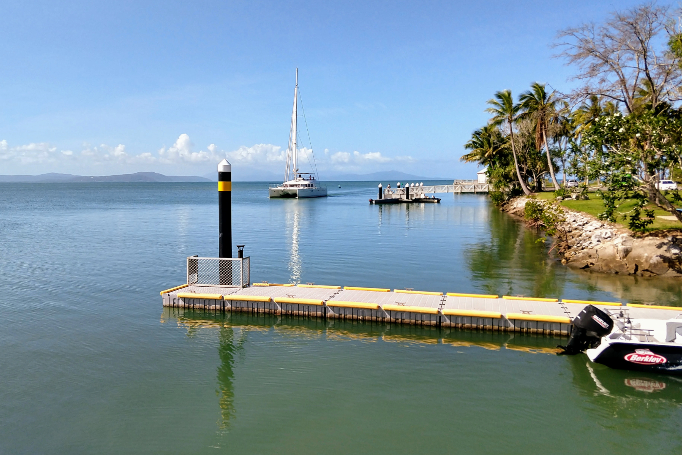 Sail boat arriving in Port Douglas on a beautiful day.